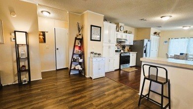 Nestled within the highly sought-after golf course community of on Blue Heron Pines Golf Course in Florida - for sale on GolfHomes.com, golf home, golf lot