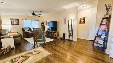 Nestled within the highly sought-after golf course community of on Blue Heron Pines Golf Course in Florida - for sale on GolfHomes.com, golf home, golf lot