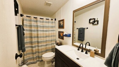 Nestled within the highly sought-after golf course community of on Blue Heron Pines Golf Course in Florida - for sale on GolfHomes.com, golf home, golf lot
