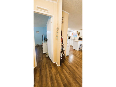 Nestled within the highly sought-after golf course community of on Blue Heron Pines Golf Course in Florida - for sale on GolfHomes.com, golf home, golf lot