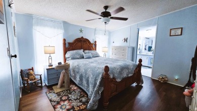 Nestled within the highly sought-after golf course community of on Blue Heron Pines Golf Course in Florida - for sale on GolfHomes.com, golf home, golf lot