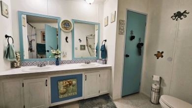 Nestled within the highly sought-after golf course community of on Blue Heron Pines Golf Course in Florida - for sale on GolfHomes.com, golf home, golf lot