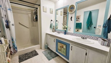 Nestled within the highly sought-after golf course community of on Blue Heron Pines Golf Course in Florida - for sale on GolfHomes.com, golf home, golf lot