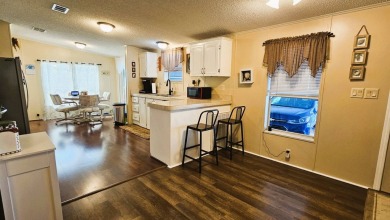 Nestled within the highly sought-after golf course community of on Blue Heron Pines Golf Course in Florida - for sale on GolfHomes.com, golf home, golf lot