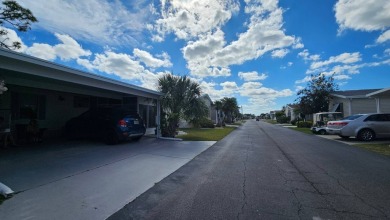 Nestled within the highly sought-after golf course community of on Blue Heron Pines Golf Course in Florida - for sale on GolfHomes.com, golf home, golf lot