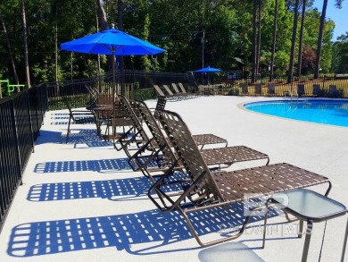 This BRICK one story home is located on a vibrant tucked away on Lake Forest Yacht and Country Club in Alabama - for sale on GolfHomes.com, golf home, golf lot
