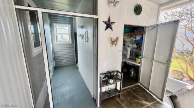 Welcome to this charming and well-maintained manufactured home on Riverbend Golf and Country Club in Florida - for sale on GolfHomes.com, golf home, golf lot