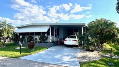 Welcome to this charming and well-maintained manufactured home on Riverbend Golf and Country Club in Florida - for sale on GolfHomes.com, golf home, golf lot