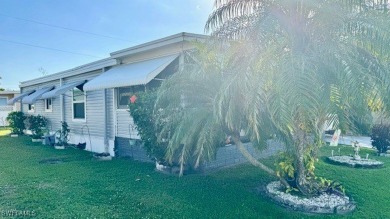 Welcome to this charming and well-maintained manufactured home on Riverbend Golf and Country Club in Florida - for sale on GolfHomes.com, golf home, golf lot