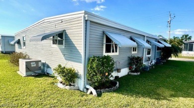 Welcome to this charming and well-maintained manufactured home on Riverbend Golf and Country Club in Florida - for sale on GolfHomes.com, golf home, golf lot