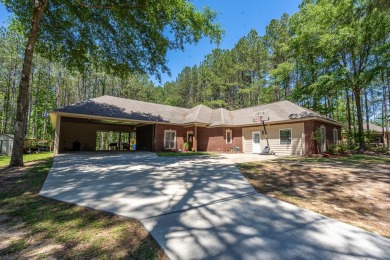 Welcome to your dream home in the serene Beaver Lake Subdivision on Pine Creek Golf Club in Mississippi - for sale on GolfHomes.com, golf home, golf lot