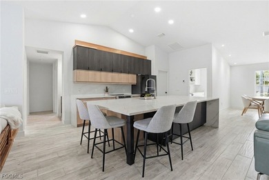 Luxury Waterfront Living in the Heart of Cape Coral's on Royal Tee Country Club in Florida - for sale on GolfHomes.com, golf home, golf lot