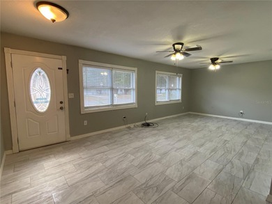 Charming and move-in ready block single family home featuring 2 on Zephyrhills Municipal Golf Course in Florida - for sale on GolfHomes.com, golf home, golf lot