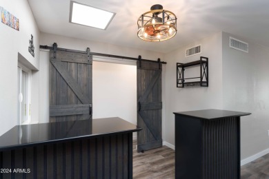 Discover this beautifully remodeled Sun City home in a thriving on Sun City Lakes West and East in Arizona - for sale on GolfHomes.com, golf home, golf lot