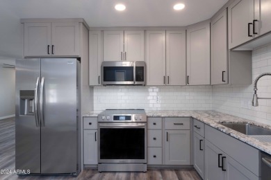 Discover this beautifully remodeled Sun City home in a thriving on Sun City Lakes West and East in Arizona - for sale on GolfHomes.com, golf home, golf lot