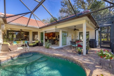 A captivating lake view with mature trees draws you in the on Legacy Golf Club in Florida - for sale on GolfHomes.com, golf home, golf lot