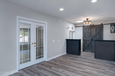 Discover this beautifully remodeled Sun City home in a thriving on Sun City Lakes West and East in Arizona - for sale on GolfHomes.com, golf home, golf lot