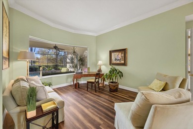 A captivating lake view with mature trees draws you in the on Legacy Golf Club in Florida - for sale on GolfHomes.com, golf home, golf lot