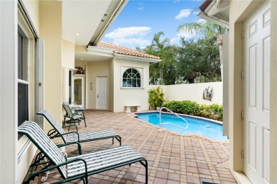 Courtyard pool home on a golf course in the coveted Grand Harbor on Grand Harbor Golf and Country Club in Florida - for sale on GolfHomes.com, golf home, golf lot