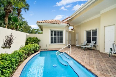 Courtyard pool home on a golf course in the coveted Grand Harbor on Grand Harbor Golf and Country Club in Florida - for sale on GolfHomes.com, golf home, golf lot