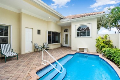 Courtyard pool home on a golf course in the coveted Grand Harbor on Grand Harbor Golf and Country Club in Florida - for sale on GolfHomes.com, golf home, golf lot