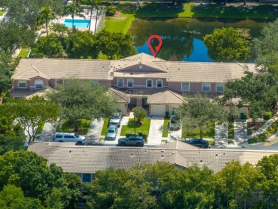 Affordable and stylishly renovated waterfront townhouse in the on Woodmont Country Club in Florida - for sale on GolfHomes.com, golf home, golf lot