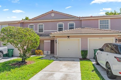 Affordable and stylishly renovated waterfront townhouse in the on Woodmont Country Club in Florida - for sale on GolfHomes.com, golf home, golf lot