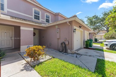 Affordable and stylishly renovated waterfront townhouse in the on Woodmont Country Club in Florida - for sale on GolfHomes.com, golf home, golf lot
