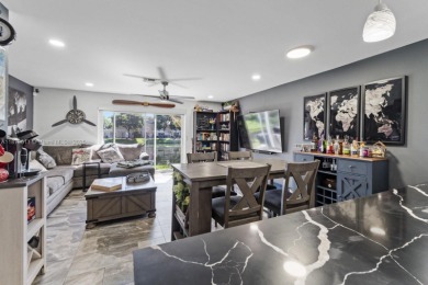 Affordable and stylishly renovated waterfront townhouse in the on Woodmont Country Club in Florida - for sale on GolfHomes.com, golf home, golf lot