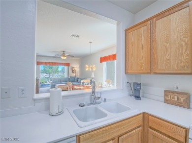 From the moment you enter the gated courtyard, you're greeted on Aliante Golf Club in Nevada - for sale on GolfHomes.com, golf home, golf lot