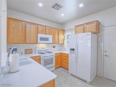 From the moment you enter the gated courtyard, you're greeted on Aliante Golf Club in Nevada - for sale on GolfHomes.com, golf home, golf lot