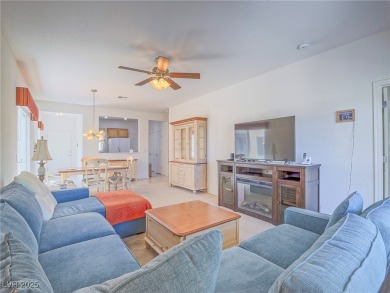 From the moment you enter the gated courtyard, you're greeted on Aliante Golf Club in Nevada - for sale on GolfHomes.com, golf home, golf lot