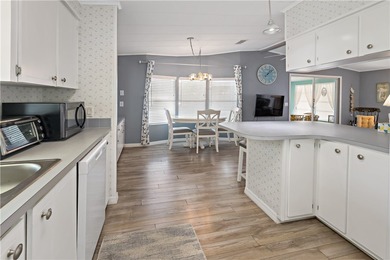 Adorable 2 bed, 2 bath home on a desirable corner lot in on Barefoot Bay Golf Course in Florida - for sale on GolfHomes.com, golf home, golf lot