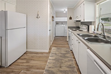 Adorable 2 bed, 2 bath home on a desirable corner lot in on Barefoot Bay Golf Course in Florida - for sale on GolfHomes.com, golf home, golf lot