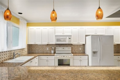 This immaculate 2/2.5 townhome in Grand Harbor comes with a on Grand Harbor Golf and Country Club in Florida - for sale on GolfHomes.com, golf home, golf lot