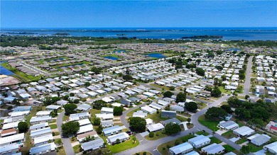 Adorable 2 bed, 2 bath home on a desirable corner lot in on Barefoot Bay Golf Course in Florida - for sale on GolfHomes.com, golf home, golf lot