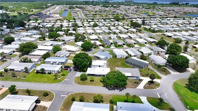 Adorable 2 bed, 2 bath home on a desirable corner lot in on Barefoot Bay Golf Course in Florida - for sale on GolfHomes.com, golf home, golf lot