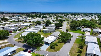 Adorable 2 bed, 2 bath home on a desirable corner lot in on Barefoot Bay Golf Course in Florida - for sale on GolfHomes.com, golf home, golf lot