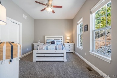 Welcome to this exceptional home in the coveted Redhead Cove on The Oaks Golf Course in Missouri - for sale on GolfHomes.com, golf home, golf lot