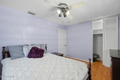 Savor the Florida lifestyle in this charming three-bedroom pool on Daytona Beach Golf Club in Florida - for sale on GolfHomes.com, golf home, golf lot