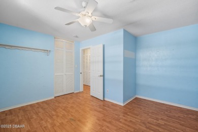 Savor the Florida lifestyle in this charming three-bedroom pool on Daytona Beach Golf Club in Florida - for sale on GolfHomes.com, golf home, golf lot