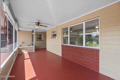 Savor the Florida lifestyle in this charming three-bedroom pool on Daytona Beach Golf Club in Florida - for sale on GolfHomes.com, golf home, golf lot