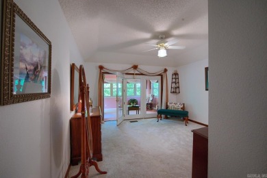 A SERENE RETREAT!  Meticulously landscaped, this tastefully on Cortez Golf Course in Arkansas - for sale on GolfHomes.com, golf home, golf lot