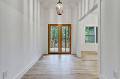 This stunning new construction blends luxury, functionality, and on The Highlands Course at Lake Arrowhead in Georgia - for sale on GolfHomes.com, golf home, golf lot