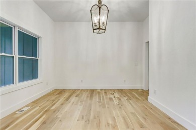 This stunning new construction blends luxury, functionality, and on The Highlands Course at Lake Arrowhead in Georgia - for sale on GolfHomes.com, golf home, golf lot