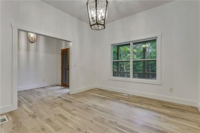 This stunning new construction blends luxury, functionality, and on The Highlands Course at Lake Arrowhead in Georgia - for sale on GolfHomes.com, golf home, golf lot