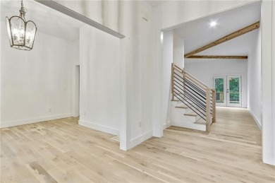 This stunning new construction blends luxury, functionality, and on The Highlands Course at Lake Arrowhead in Georgia - for sale on GolfHomes.com, golf home, golf lot