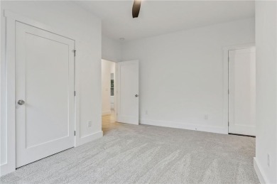 This stunning new construction blends luxury, functionality, and on The Highlands Course at Lake Arrowhead in Georgia - for sale on GolfHomes.com, golf home, golf lot