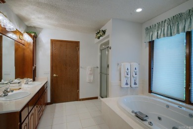 A SERENE RETREAT!  Meticulously landscaped, this tastefully on Cortez Golf Course in Arkansas - for sale on GolfHomes.com, golf home, golf lot