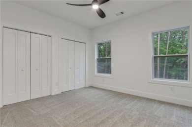 This stunning new construction blends luxury, functionality, and on The Highlands Course at Lake Arrowhead in Georgia - for sale on GolfHomes.com, golf home, golf lot